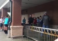 Churchgoers gather for song and prayer outside grocery store during Hurricane Florence