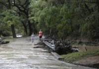 Heavy rain caused more than 70 road closures as flash flood watch extends into Monday