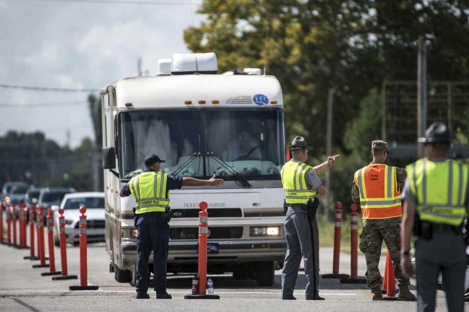 Members of law enforcement work with the National Guard to direct traffic onto U.S. Highway 501 as Hurricane Florence approaches the East Coast Wednesday, Sept. 12, 2018, near Conway, S.C. Time is running short to get out of the way of Hurricane Florence, a monster of a storm that has a region of more than 10 million people in its potentially devastating sights. Photo: Sean Rayford, AP / The Associated Press