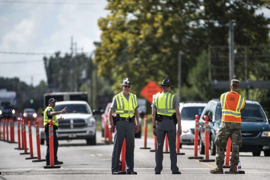 Members of law enforcement work with the National Guard to direct traffic onto U.S. Highway 501 as Hurricane Florence approaches the East Coast Wednesday, Sept. 12, 2018, near Conway, S.C. Time is running short to get out of the way of Hurricane Florence, a monster of a storm that has a region of more than 10 million people in its potentially devastating sights. Photo: Sean Rayford, AP / The Associated Press