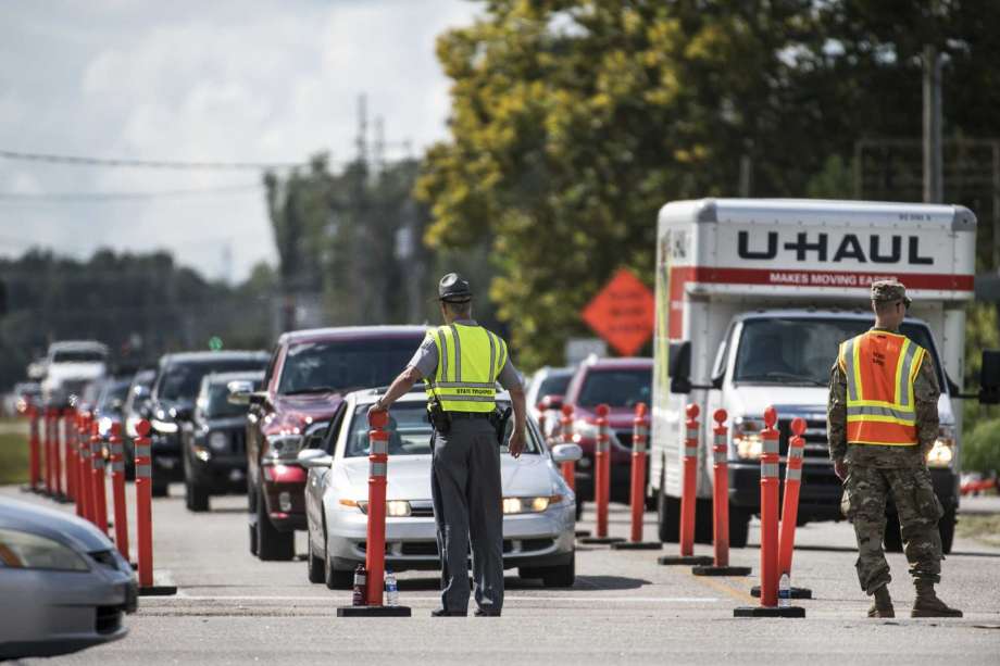Members of law enforcement work with the National Guard to direct traffic onto U.S. Highway 501 as Hurricane Florence approaches the East Coast Wednesday, Sept. 12, 2018, near Conway, S.C. Time is running short to get out of the way of Hurricane Florence, a monster of a storm that has a region of more than 10 million people in its potentially devastating sights. Photo: Sean Rayford, AP / The Associated Press