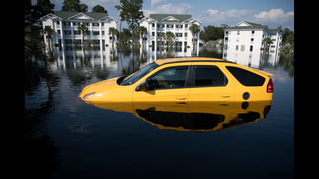 A car is inundated with floodwaters caused by Hurricane Florence at an apartment complex at Aberdeen Country Club in Longs, South Carolina. Floodwaters are expected to rise through the weekend in the area. (Photo by Sean Rayford/Getty Images)