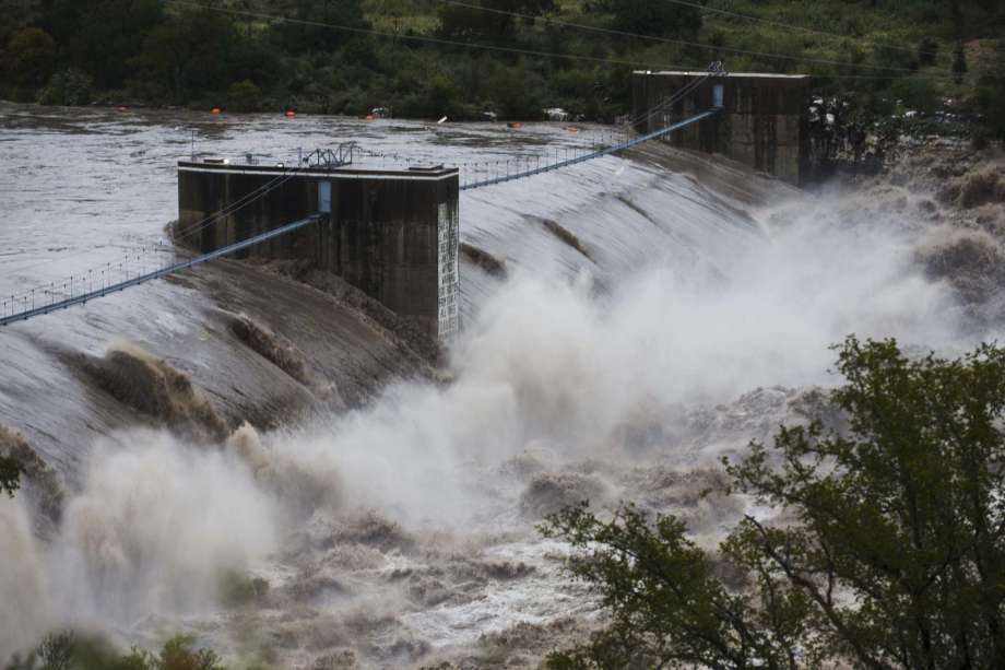 Water from the Colorado River pours over the Max Starcke Dam, Tuesday Oct. 16, 2018, in Marble Falls, Texas. The Llano and Colorado rivers meet at Kingsland and the National Weather Service said both were experiencing "major flooding." A flash flood warning was in effect. (Amanda Voisard/Austin American-Statesman via AP) Photo: Amanda Voisard, Associated Press / Austin American-Statesman