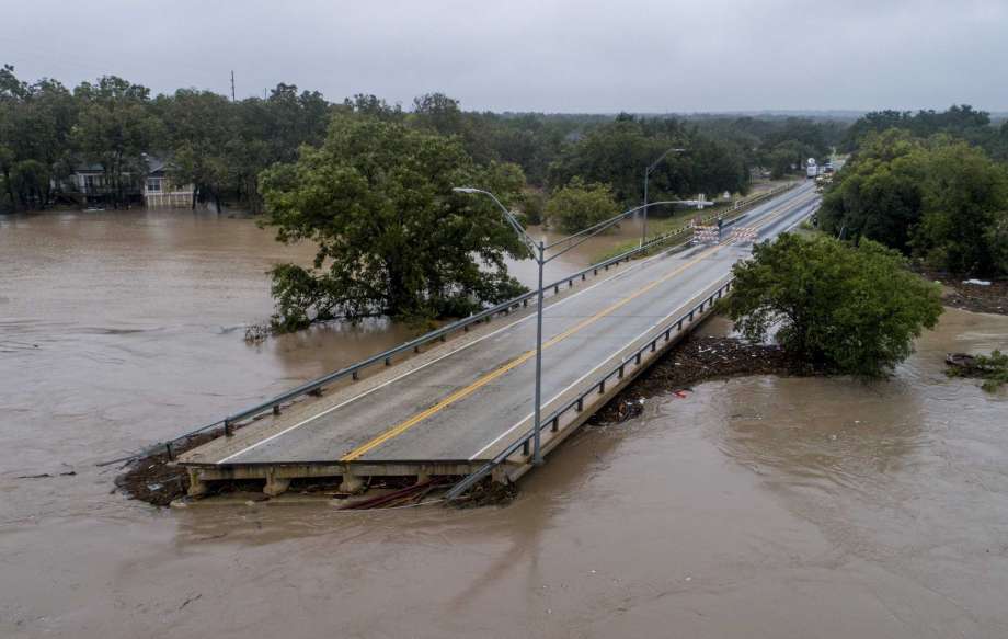 The Llano River flows past one sides of Ranch Road 2900 bridge after the bridge was washed out due to flooding Tuesday, Oct. 16, 2018, in Kingsland, Texas. (Jay Janner/Austin American-Statesman via AP) Photo: Jay Janner, Associated Press / Austin American-Statesman