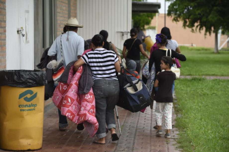 People arrive at an improvised shelter in Escuinapa, Sinaloa state, Mexico, on October 23, 2018, before the arrival of Hurricane Willa. The Category 4 hurricane was on course to slam into Mexico somewhere around the resort town of Mazatlan on Tuesday evening. Photo: ALFREDO ESTRELLA, AFP/Getty Images / AFP or licensors