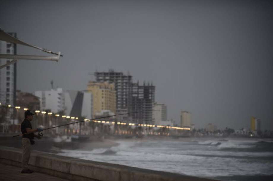 A man fishes at Mazatlan's coastline, in Sinaloa state, Mexico, on October 23, 2018, before the arrival of Hurricane Willa.  Photo: ALFREDO ESTRELLA, AFP/Getty Images / AFP or licensors