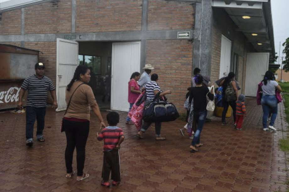 People arrive at an improvised shelter in Escuinapa, Sinaloa state, Mexico, on October 23, 2018, before the arrival of Hurricane Willa.  Photo: ALFREDO ESTRELLA, AFP/Getty Images / AFP or licensors