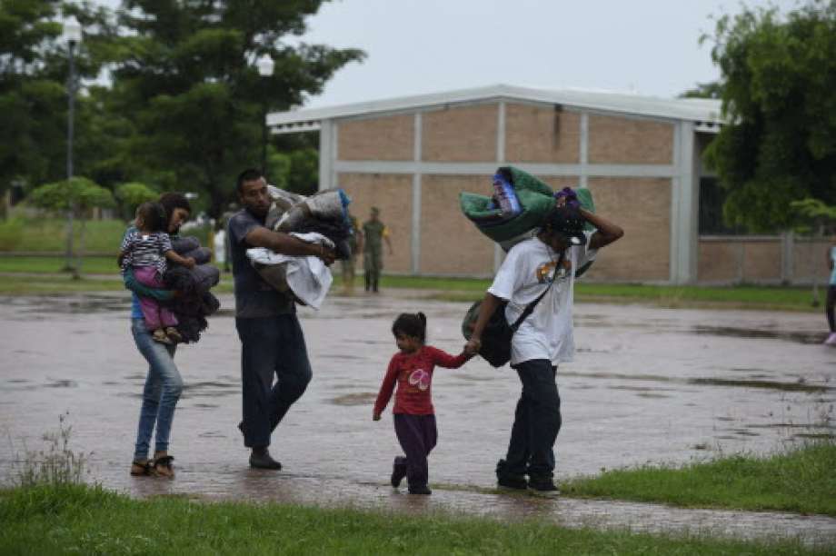 People arrive at an improvised shelter in Escuinapa, Sinaloa state, Mexico, on October 23, 2018, before the arrival of Hurricane Willa.  Photo: ALFREDO ESTRELLA, AFP/Getty Images / AFP or licensors