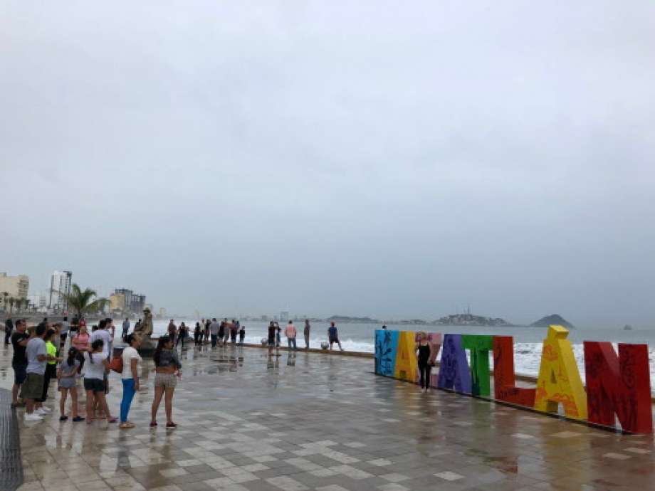 Tourists pose for pictures in Mazatlan, Sinaloa state, Mexico on October 23, 2018, before the arrival of Hurricane Willa.  Photo: DANIEL SLIM, AFP/Getty Images / AFP or licensors