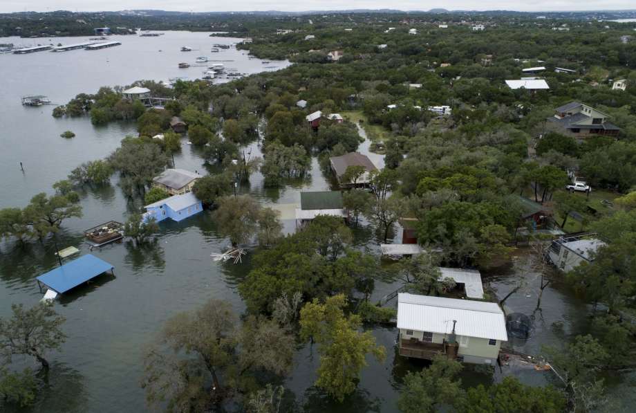 AFTER: Houses are flooded at Graveyard Point on Lake Travis Wednesday, Oct. 17, 2018, in Austin, Texas. Photo: Jay Janner/AP