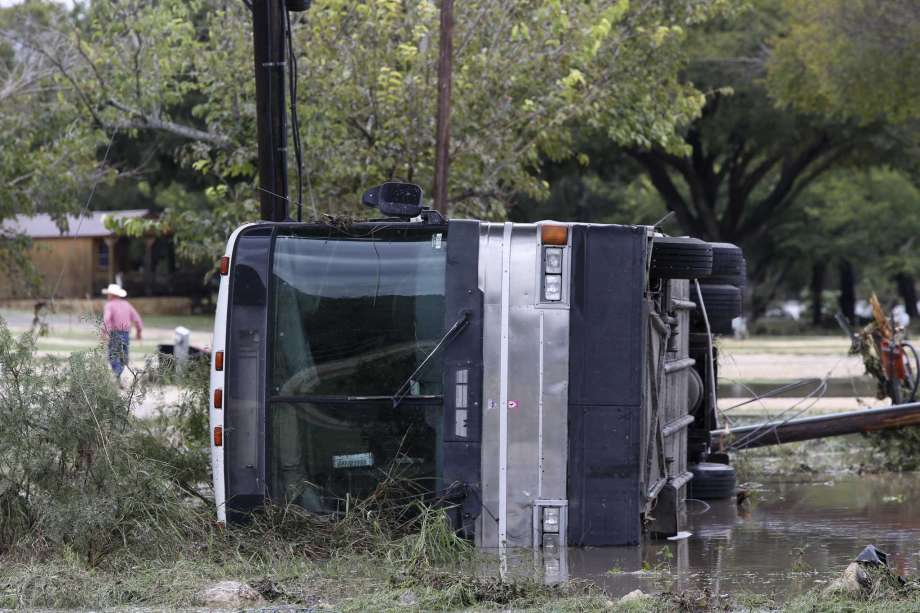 A recreation vehicle is seen on its side Monday at the South Llano River RV Park &amp; Resort in Junction. Photo: Jerry Lara /Staff File Photo / © 2018 San Antonio Express-News
