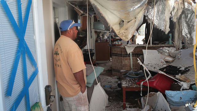 A contractor looks over a home that was severely damaged by Hurricane Michael on October 14, 2018 in Panama City, Florida. (Photo by Scott Olson/Getty Images)