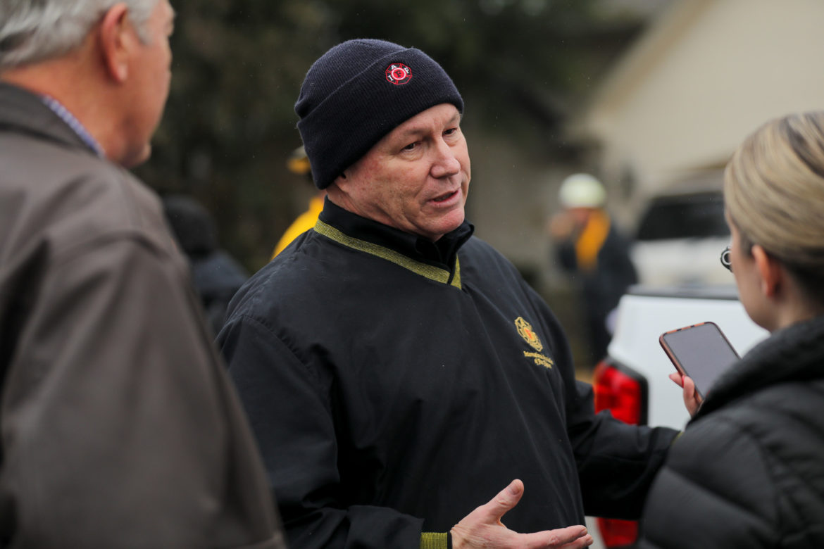 Veteran firefighter Rick Swan speaks to reporters about the risks of fast moving wildfires.