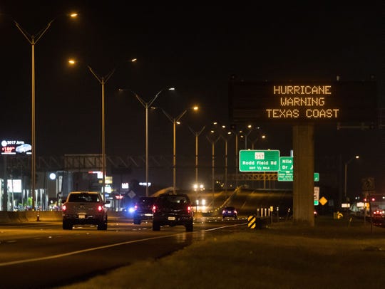 A sign over S. Padre Island Drive alerts residents