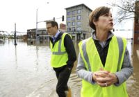 The Latest: 3 deaths blamed on flooding; kayaker missing