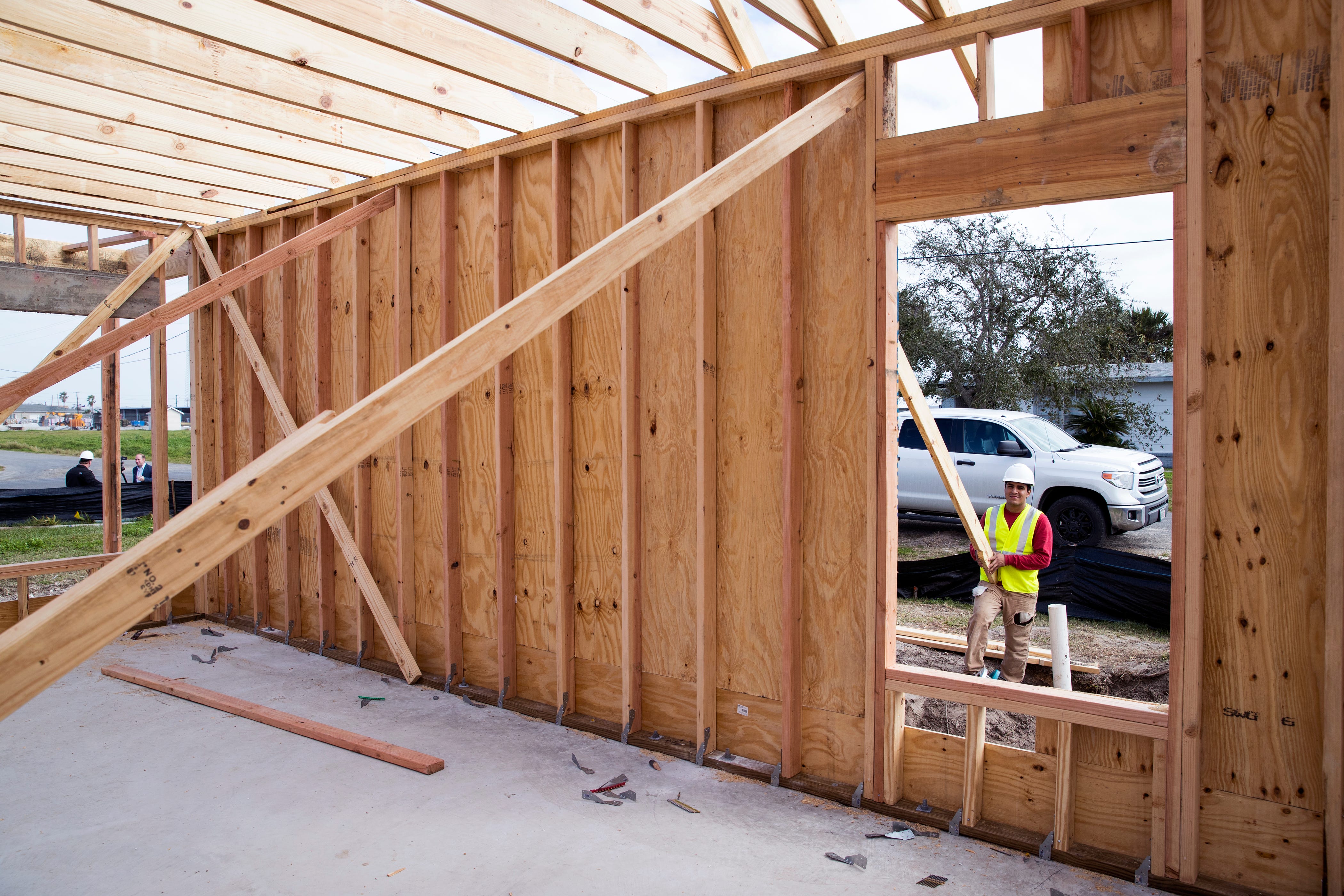 Joshua Alvarez, with the Louisiana-based Bautista Group, works on a home being rebuilt under the Homeowner Assistance Program in Rockport on Tuesday, January 22, 2019. The home will be built in 18 days from start to finish and will replace a home destroyed by Hurricane Harvey. The General Land Office has allocated more than a billion dollars to the program, which will help thousands of Texans who were affected by Hurricane Harvey recover.