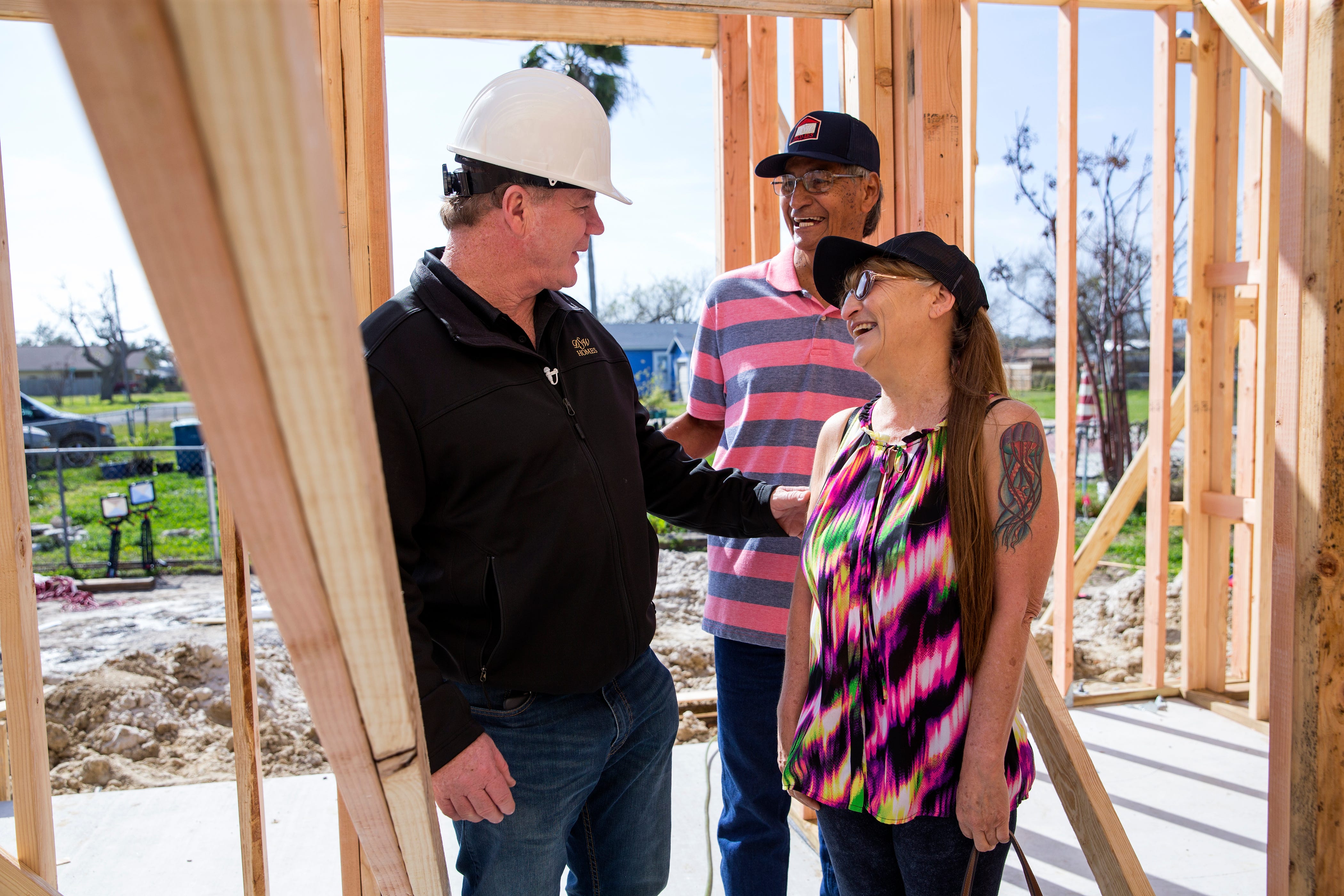 Steve Mataro (clockwise from left), owner of DSW Homes, and Juan and Juanita Rodriguez gives a tour what will be the Rodriguez' new home in about 10 days during a walkthrough showing progress on Tuesday, January 22, 2019 in Rockport. Their home was damaged by Hurricane Harvey and was beyond repair, under the Homeowner Assistance Program they are getting the help they needed to get their home rebuilt. The General Land Office has allocated more than a billion dollars to the program, which will help thousands of Texans who were affected by Hurricane Harvey recover.