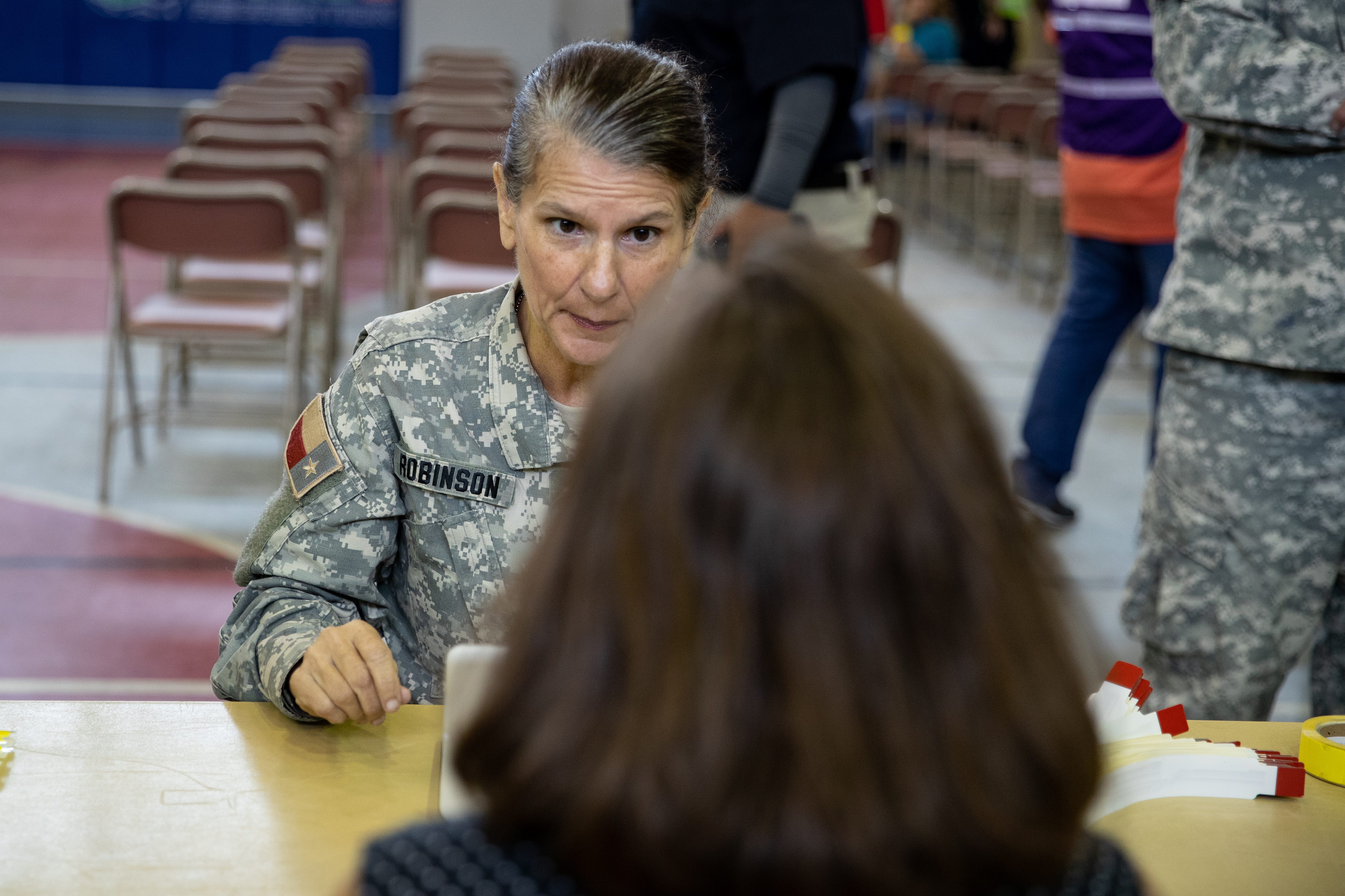 Members of the Texas State Guard take peoples information as the City of Corpus Christi,Texas Department Emergency Management and other agencies conduct a Hurricane evacuation drill at the Cabaniss natatorium on Friday, June 21, 2019.