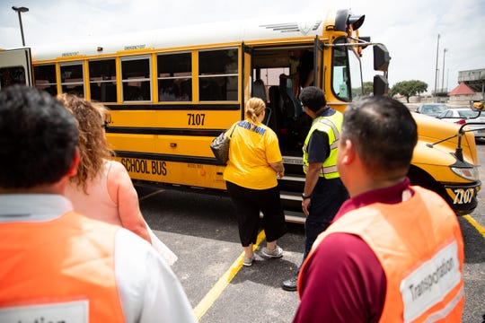 Evacuees are loaded on to buses as the city of Corpus Christi, Texas Department of Emergency Management and other agencies conduct a hurricane evacuation drill at the Cabaniss natatorium on Friday, June 21, 2019.