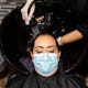 Angela Hernandez has her hair watched at Kosmo Salon on Friday, May 8, 2020. Barbershops and nail salons reopened on Friday, May 8, 2020 as part of Texas Gov. Greg Abbott's plan to reopen after coronavirus closures.