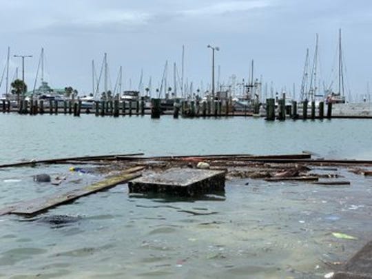 Debris floats in the Corpus Christi marina on Sunday, July 26, 2020 after Hurricane Hanna made landfall.