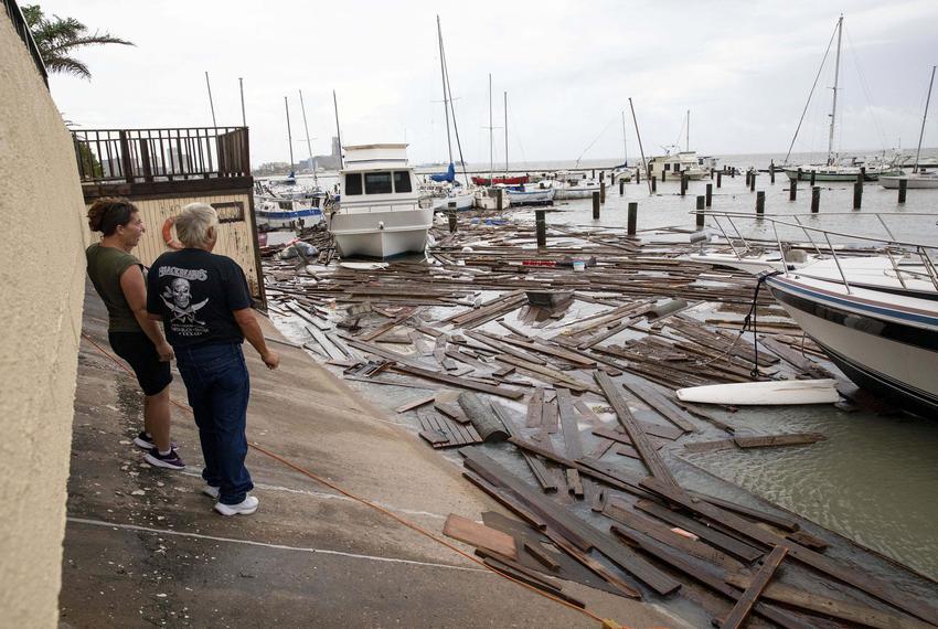Boat owners survey the damage at Harbor Del Sol Marina the morning after Hurricane Hanna in Corpus Christi.