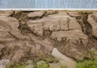This private border wall was already at risk of falling down if not fixed. A hurricane made things worse.