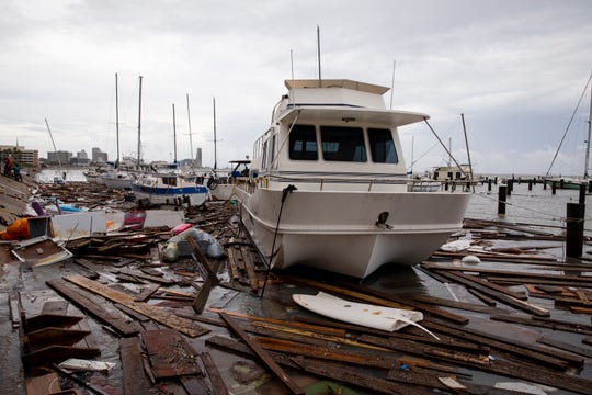 Debris fought among boats in the heavily damaged Harbor Del Sol Marina the morning after Hurricane Hanna on Sunday, July 26, 2020. 