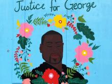 Mural on South Wilmington Street of George Floyd by artist Shirien Creates.
