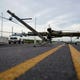 Down power lines stretch across a road in the aftermath of Hurricane Laura Thursday, Aug. 27, 2020, in Sabine Pass, Texas. (AP Photo/Eric Gay)