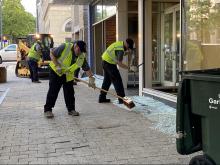 Clean-up crews are downtown Raleigh sweeping up broken glass off the streets. 