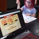 Jennifer Mahan helps teach her children at home on Wednesday, May 20, 2020, in Portland. Mahan says that she hopes schools will reopen in the fall.