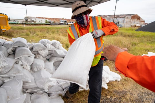 Employees with the city of Corpus Christi load sandbags for residents as Tropical Storm Hanna approached the area on Friday, July 24, 2020.