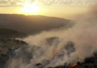 Mideast wildfires kill 3, force thousands to flee homes