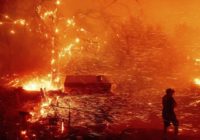 Wind fans wildfire in California canyons, residents flee