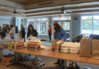 Volunteers help tornado victims recover