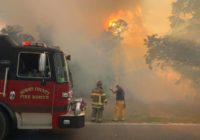 Wind-driven wildfire damages structures near Loris