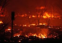 Thousands flee as Colorado wildfires burn hundreds of homes