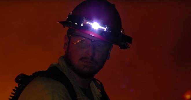 A firefighter works to contain a blaze in this courtesy image from the State of Texas. - COURTESY PHOTO / TEXAS PARK AND WILDLIFE