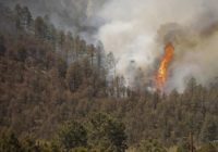 New Mexico village seeks prayers as deadly wildfire rages