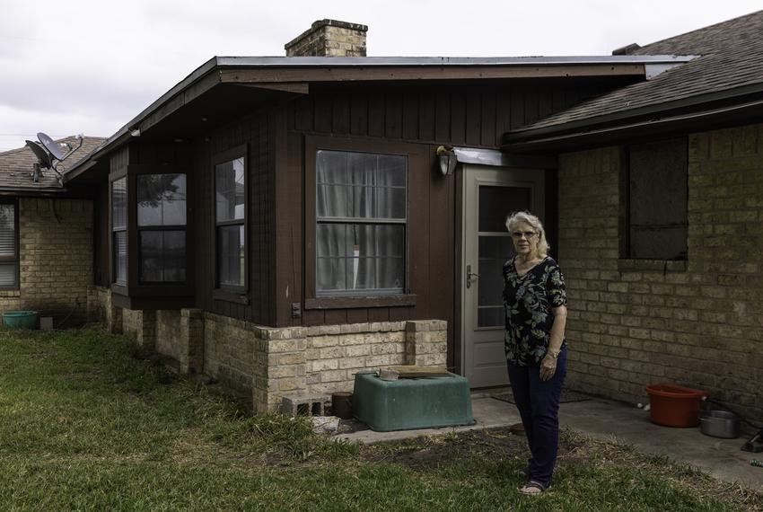 Peggy Bell stands outside her home in Robstown on May 3, 2022. Bell has lived in her home since building it in 1981. Her hom…