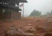 Arizona levee breached, hiker missing after floods hit southwestern US