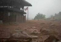Arizona levee breached, hiker missing after floods hit West