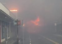 Hawaii wildfires burn homes and force evacuations as strong winds complicate the fight