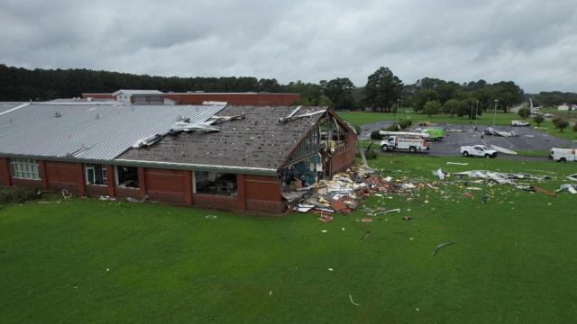 A drone flies over Springfield Middle School after an EF-3 tornado damaged the roof on Aug. 8, 2024. 