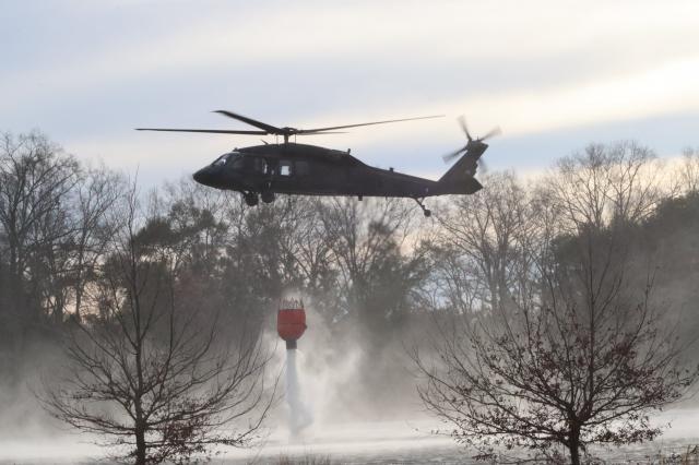 Blackhawks dump water on South Carolina wildfire (Photo: @SCNationalGuard on X) Blackhawks dump water on South Carolina wildfire (Photo: @SCNationalGuard on X)