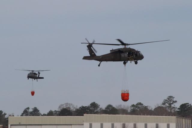 Blackhawks dump water on South Carolina wildfire (Photo: @SCNationalGuard on X) Blackhawks dump water on South Carolina wildfire (Photo: @SCNationalGuard on X)