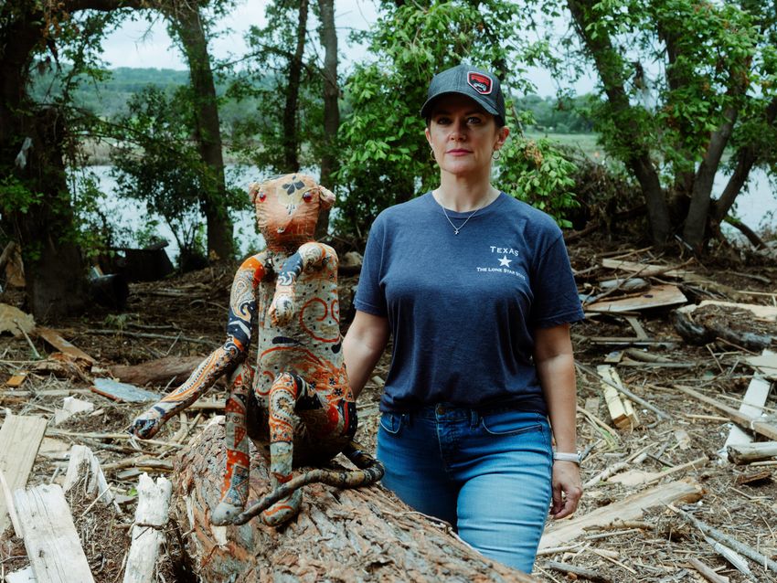 Crystal Smith, co-owner of Billy Gene's Restaurant in Kerrville, next to a stuffed monkey she found on the restaurant’s property.