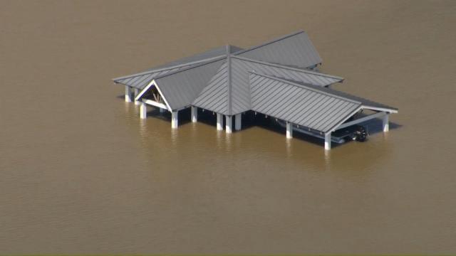 Sky 5 is flying over Hyco Lake in Person County, showing extensive flooding and docks underwater. People in the area have reported docks washing away and debris "everywhere." The lake has turned a muddy brown color. "It's a real mess," someone said.