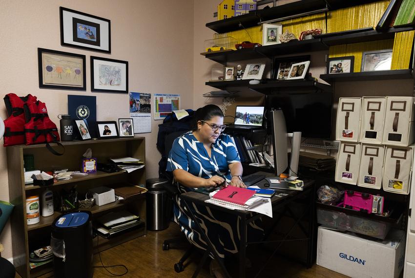 Kori Dela sits at her desk in her home office in Jonestown, Texas on July 24, 2025. Dela spoke about how many hours she spends in the office working on fundraisers, trainings, and communications running her non-profit, Live Like Cati. The non-profit focuses on the prioritization of safe water experiences for camps and aquatic facilities that have children present.